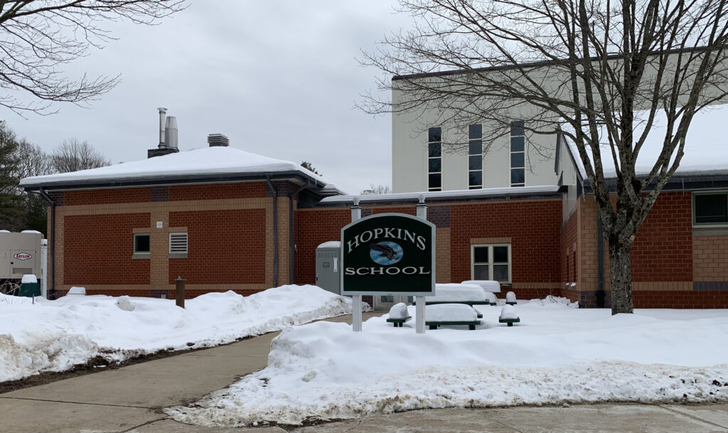 Hopkins School sign in snow