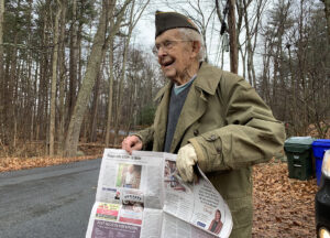 Russ Phipps with newspaper