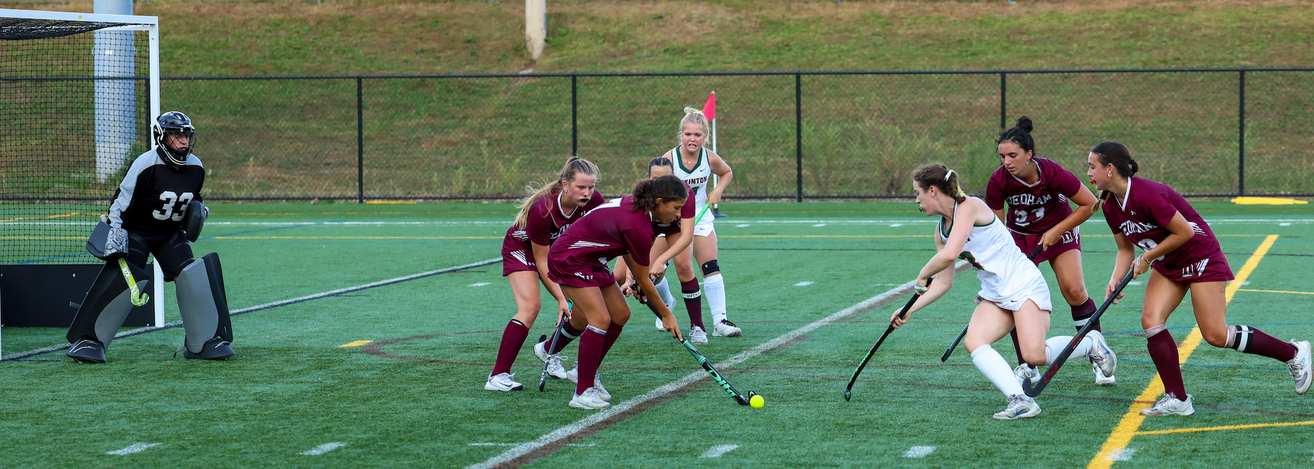 Photos: HHS field hockey drops home opener to Dedham