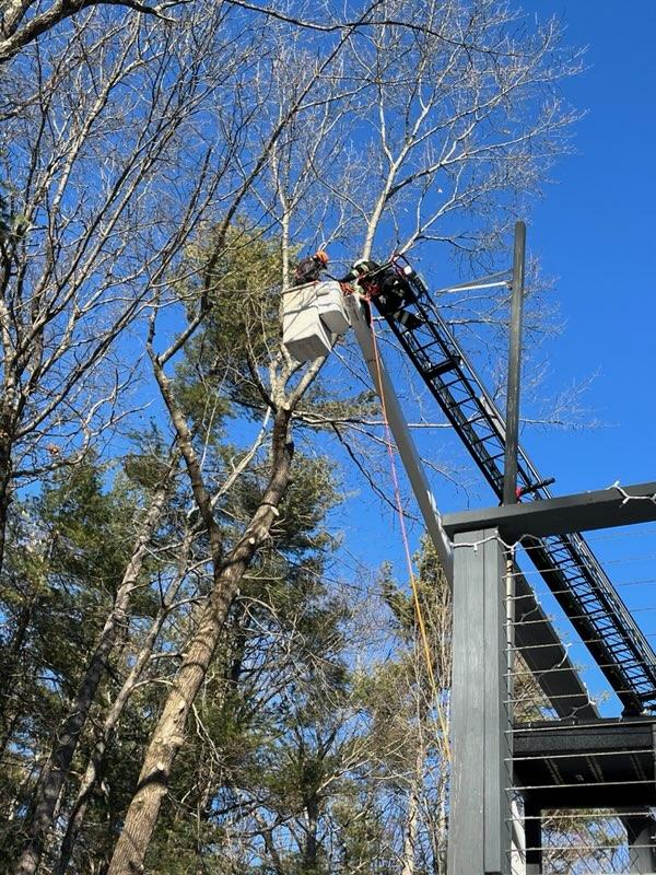 HFD assists in rescue of worker in bucket truck.