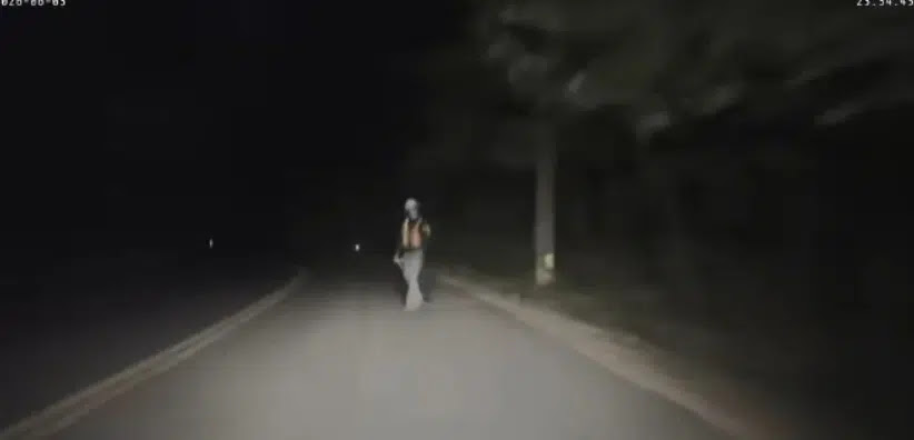 Suspicious man in road